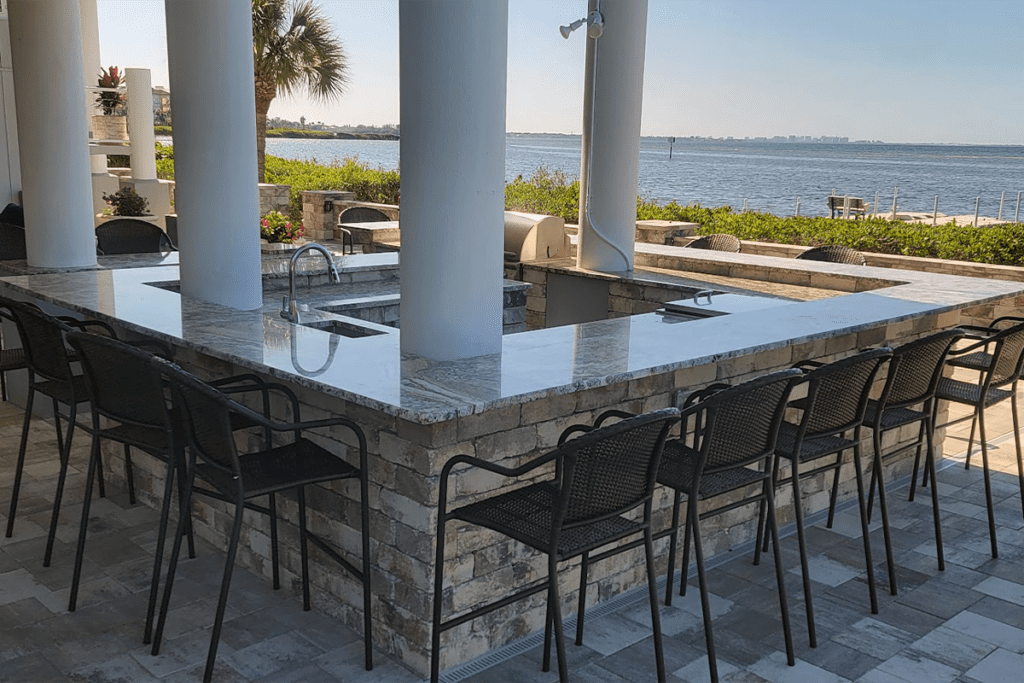 Outdoor entertaining bar with granite and custom pavers on Sarasota Bay